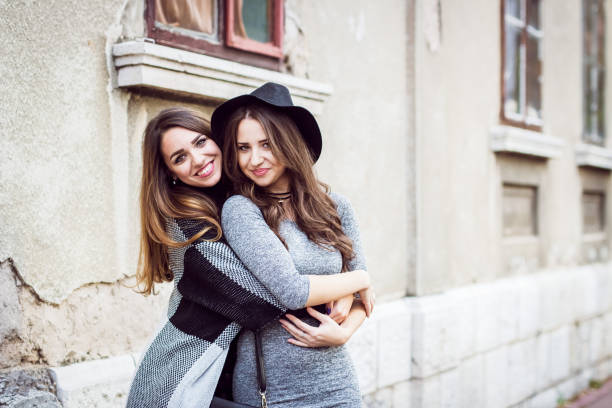 Two beautiful an young women  having fun in beautiful day
