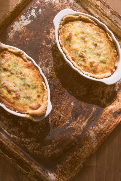 istock Leek and Pancetta Quiche on a wooden kitchen countertop on a sunny day 940569556