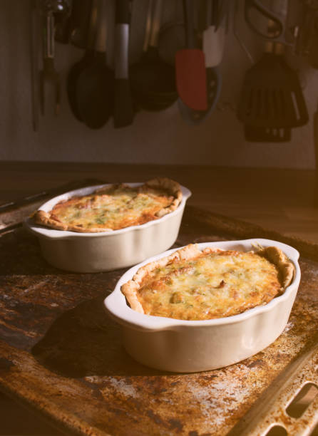 istock Leek and Pancetta Quiche on a wooden kitchen countertop on a sunny day 940569562
