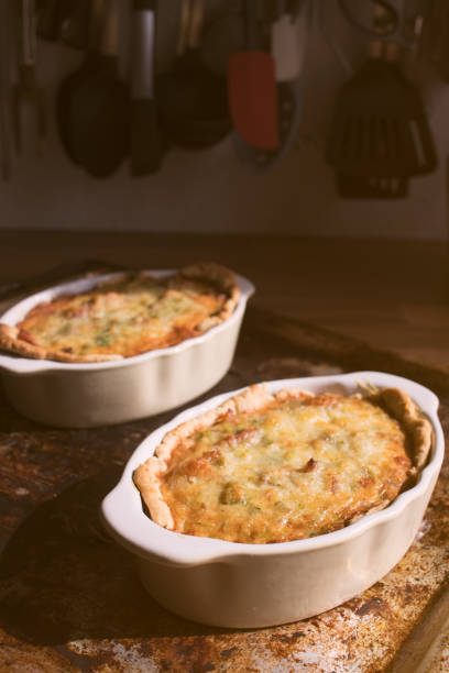 istock Leek and Pancetta Quiche on a wooden kitchen countertop on a sunny day 940569564