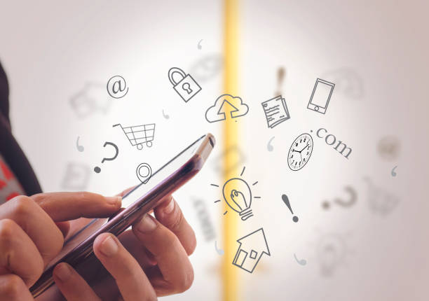 istock Hand holding smartphone with media icons and symbol 940569642