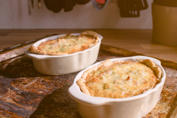 istock Leek and Pancetta Quiche on a wooden kitchen countertop on a sunny day 940569690