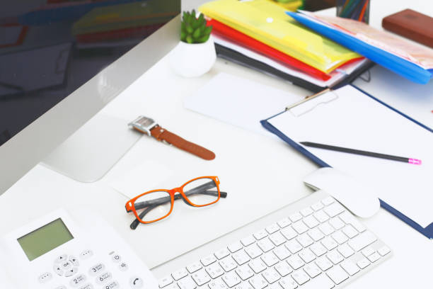 istock Workplace with notebook laptop Comfortable work table in office windows and city view 940569746