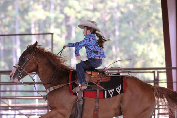 little girl running barrels with lighting fast speed - saddle blanket imagens e fotografias de stock
