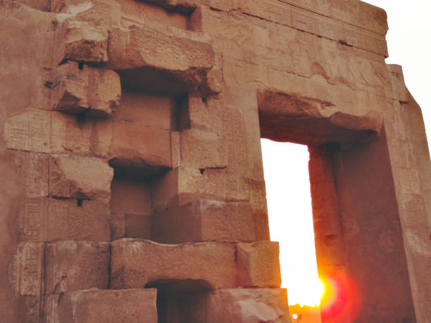 Colossi of Memnon Luxor Thebes against the background of dawn in the mountains