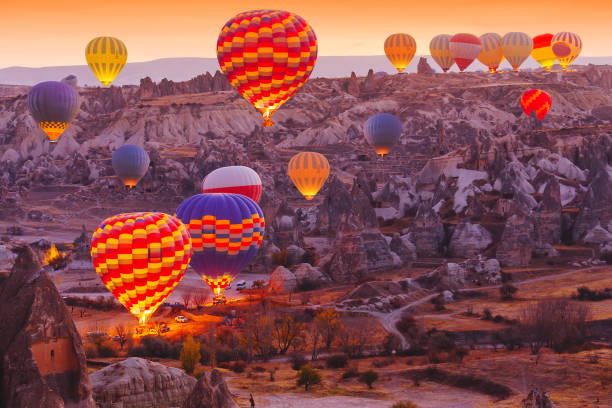 hot air balloons cappadocia landscape view. - cappadocia hot air balloon turkey basket imagens e fotografias de stock
