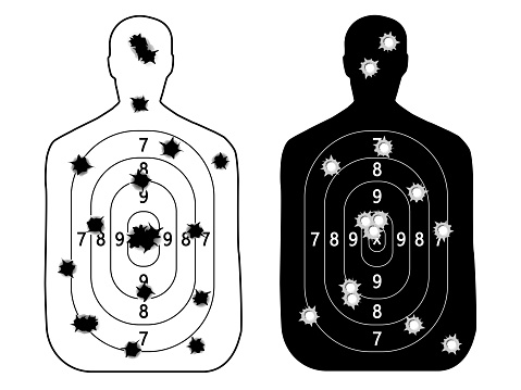 shooting range gun target with bullet holes