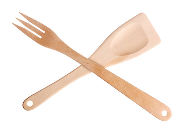 istock Wooden spatula and fork on white background 940593718