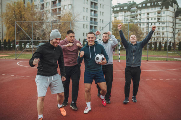 istock Soccer players celebrating victory 940618036