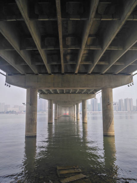 istock bottom of a big bridge cross the river vertical composition 940618062