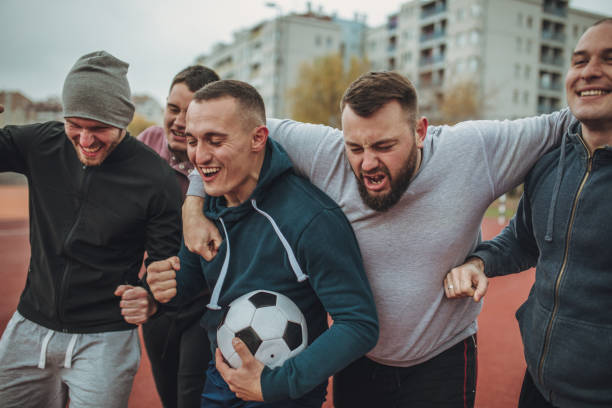 istock Soccer players celebrating winning 940618450