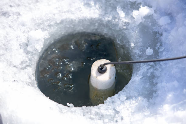 istock Sonar Device in Ice Fishing Hole 940633152