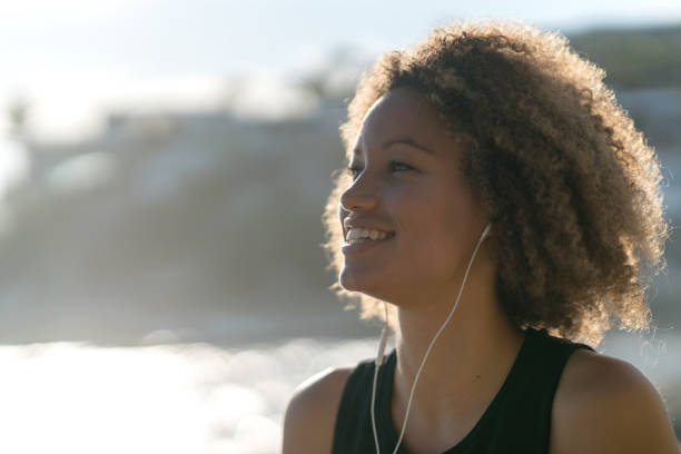 istock Female runner outdoors listening to music 940636284