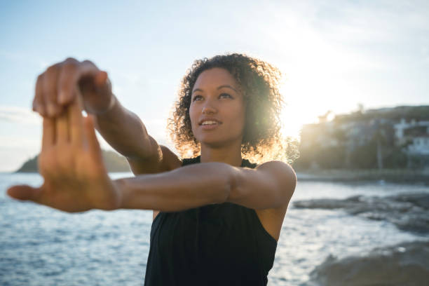 istock Fit woman exercising at the beach 940636464