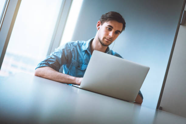 istock Focused young man working on his laptop 940637260