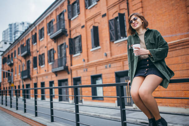 istock Woman drinking coffee outdoors 940640144