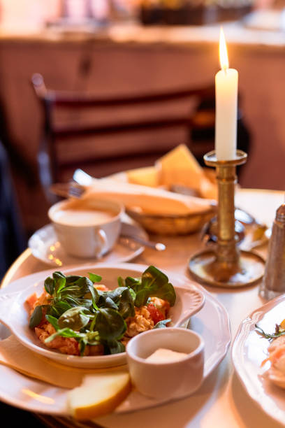 istock Table with delicious breakfast food near the window 940644840