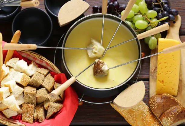 cheese fondue with bread in a special dish