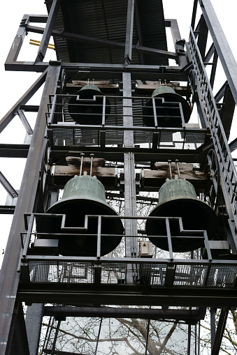 The bell tower of the Protestant Philippus Community Riederwald in Frankfurt made of a steel framework and many bells.