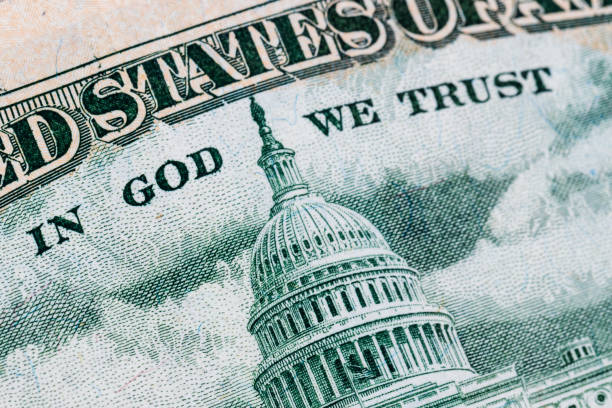 istock close-up 50 US dollar bills with in God we trust text. Background 940671016