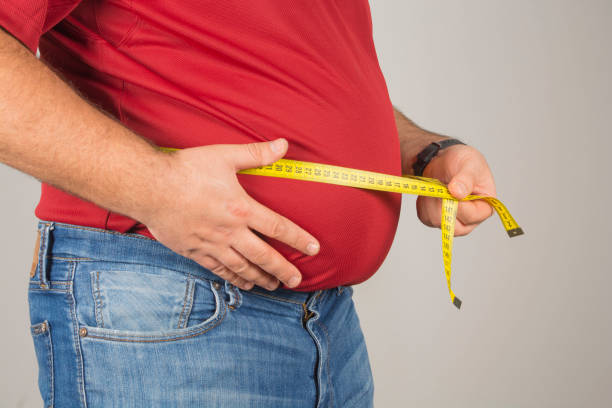 толстый человек - fat стоковые фото и изображения