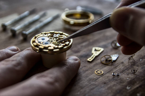 Watchmaker is repairing the mechanical watches in his workshop
