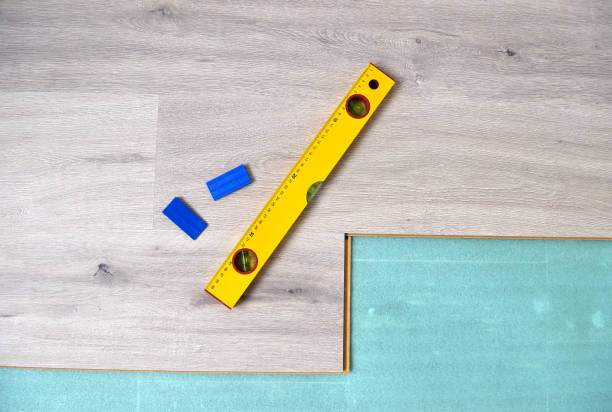 istock Floor panels, parquet, laminate, wood flooring and tools. 940682584