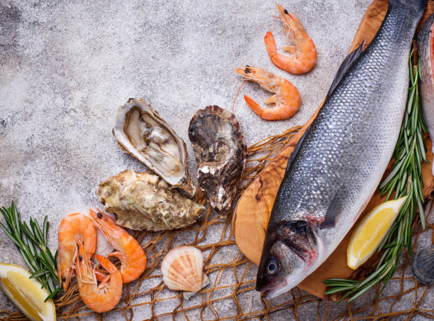 istock Seafood concept. Fish, shrimps and oysters. 940682772