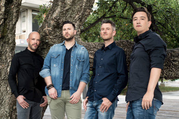 istock Male Group Posing near a Tree in the City 940693370
