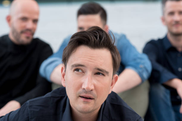 istock Handsome Adult Man Looking Up 940693386