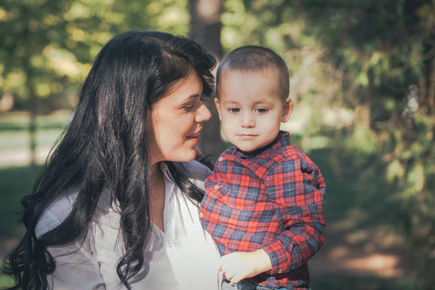 istock Mother holding a baby son in her arms 940697382