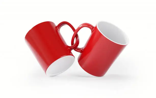 Red mugs on white background. Horizontal composition with copy space. Clipping path is included.