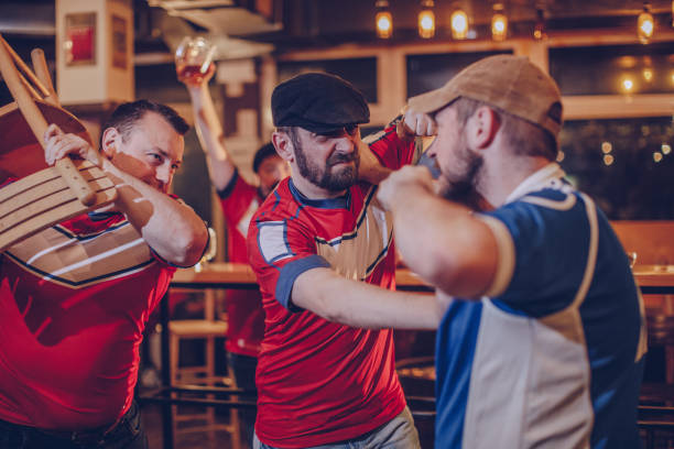 istock Group of men fighting in bar 940705074