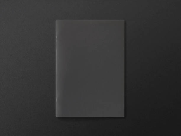 istock Black Magazine or Brochure on textured paper. Front cover top view. Template concept for your showcase. 940705438