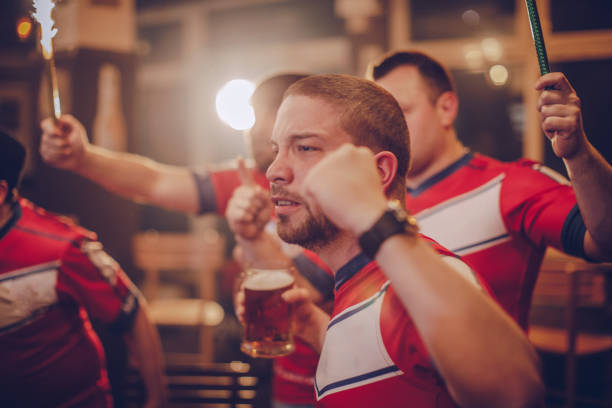 istock Football fans at bar 940706996