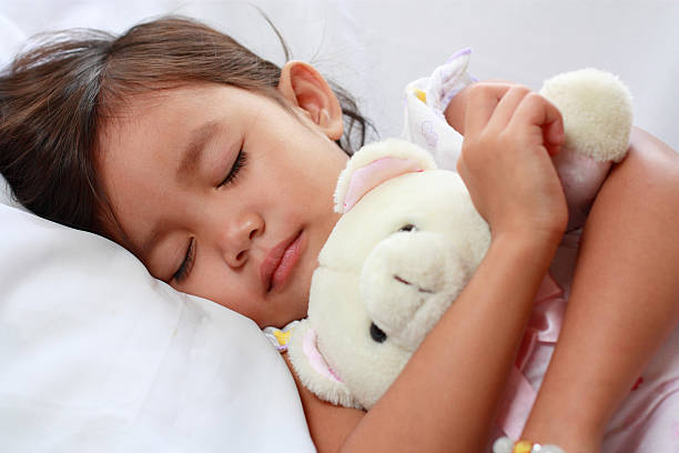 istock sleeping little asian girl 94070871