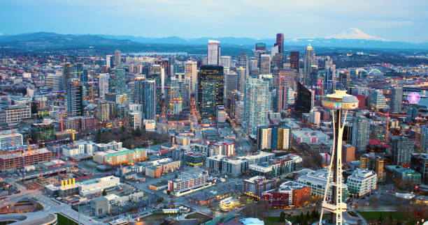 seattle space needle under remodeling construction with seattle skyline and mt rainer background aerial panorama shot from helicopter - keyarena imagens e fotografias de stock
