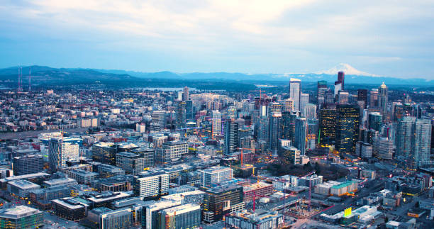 istock Seattle Washington Urban Core Downtown District Skyscrapers Mt Rainier Background at Sunset 940712258