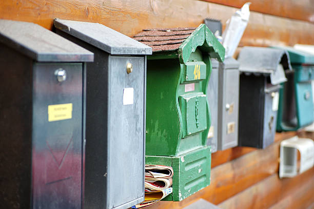 istock Various wood and metal mailboxes on a wood wall 94071455