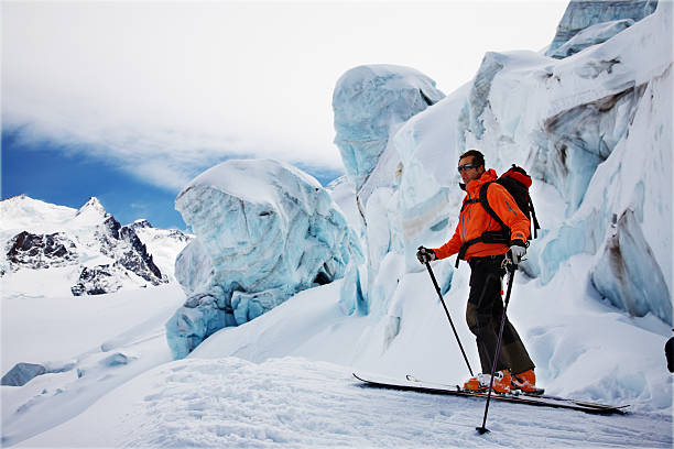 Freerider Skis Freerider Guide in the Schwartztor Glacier; in background the highest peaks of Monte Rosa (4664 mt). Zermatt, Swiss, Europe. switzerland european alps ski winter stock pictures, royalty-free photos & images