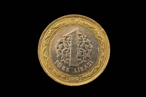 istock Turkish One Lira bimetallic Coin Isolated On Black 940715964