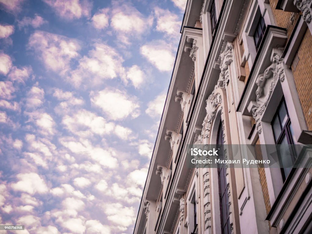 classic ancient buildings facade with blue sky with clouds Ancient Stock Photo