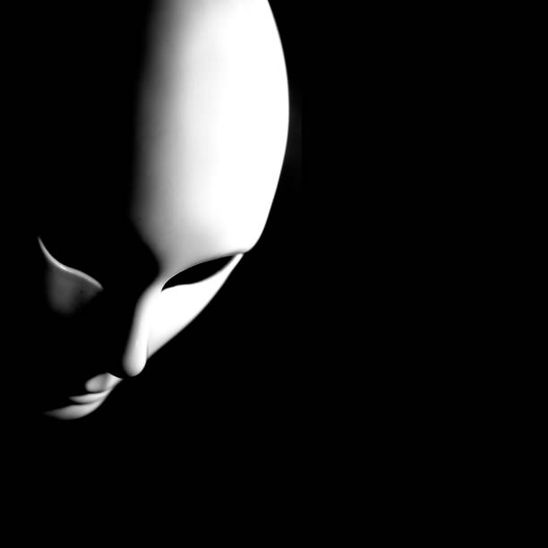 White mask of man's face on black background
