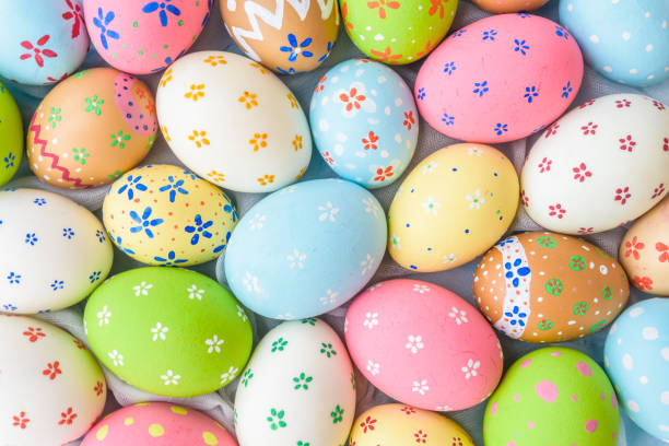 istock Happy easter!  Closeup Colorful Easter eggs background. Happy family preparing for Easter. 940719784