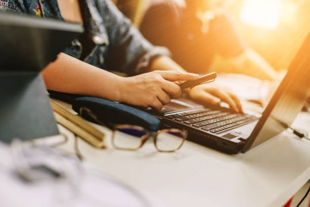 istock business ideas concept with woman hand work with laptop selective focus  vintage filter tone 940723128