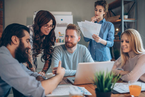 istock Creative business people having a meeting 940723436