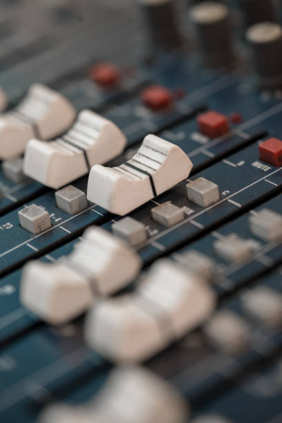 istock Close up of music mixer equalizer console for mixer control sound device. Sound technician audio mixer equalizer control for background. 940724348