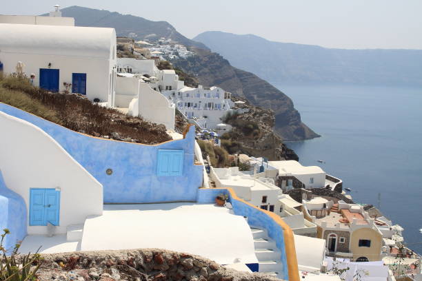 walking in the little streets of oia on the island of santorini, greece - 12014 imagens e fotografias de stock