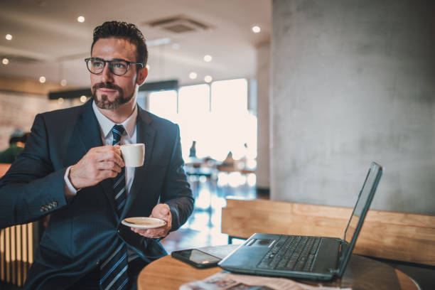 istock Businessman in coffee shop 940726976