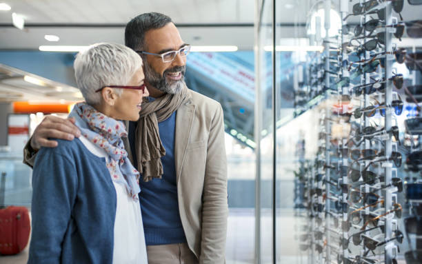 istock Mid aged couple in a shopping mall. 940727038